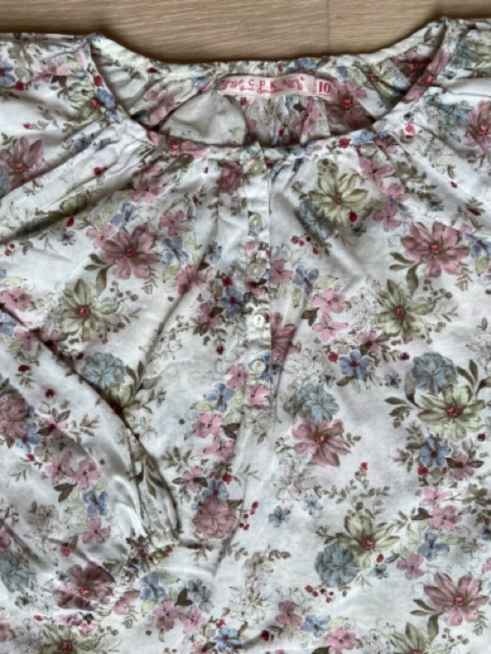 C.F.K, Pastel floral print on white background pop over Kids blouse, size 10 yrs